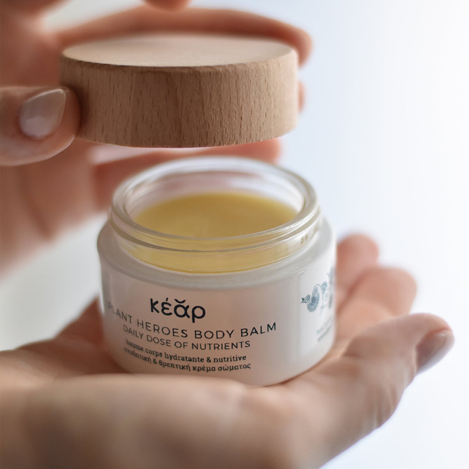 Open jar of Kear waterless Plant Heroes body balm with St. John's wort oil and calendula.