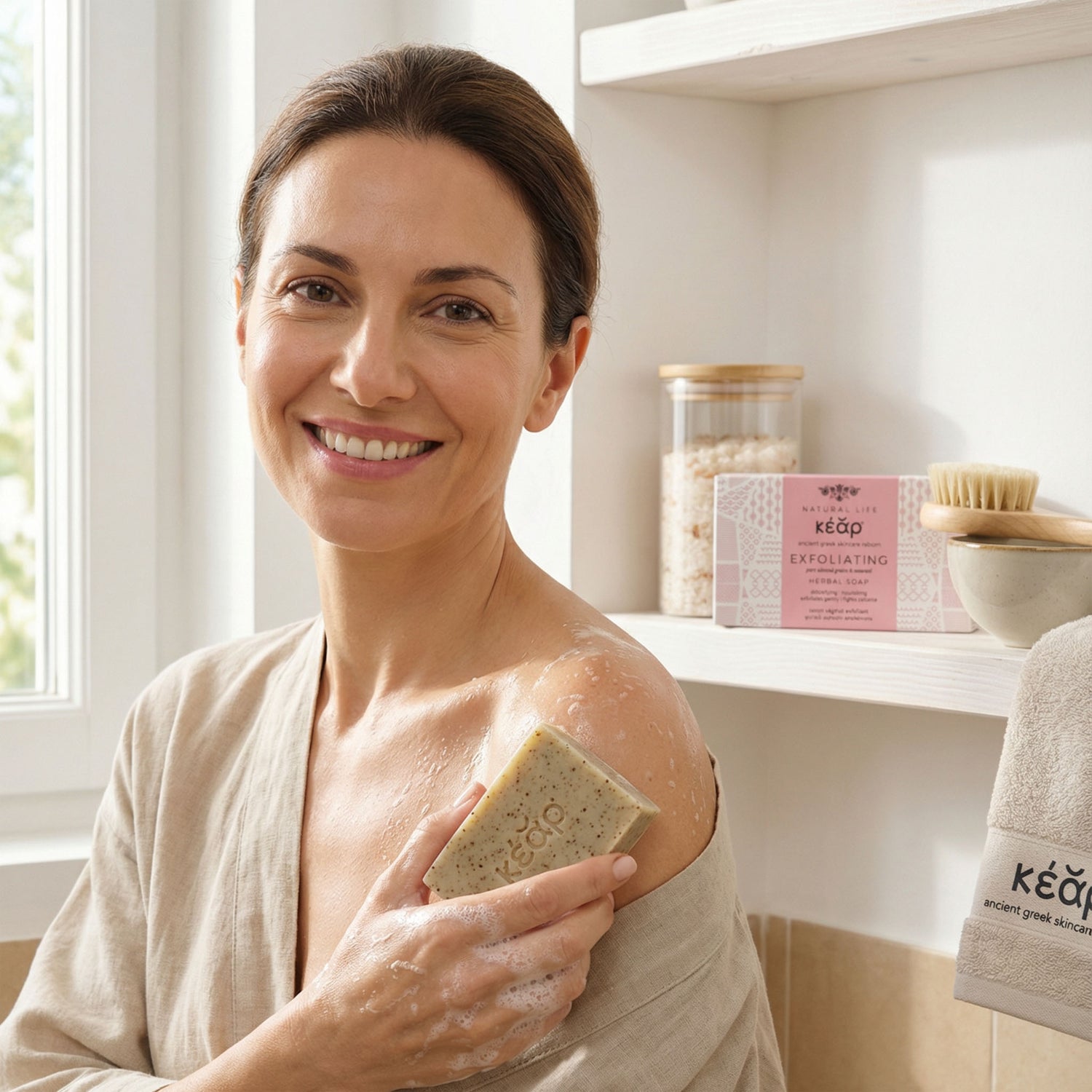 Woman using Kear Exfoliating Herbal Soap with almond grains and seaweed extract to wash her shoulder.