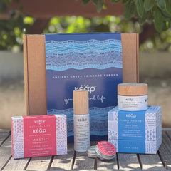 Closeup of Kear gift set with Plant Heroes body balm, Mastic Herbal Soap, One Drop Elixir face & eyes serum and SofiLip Mandarin natural lip balm.