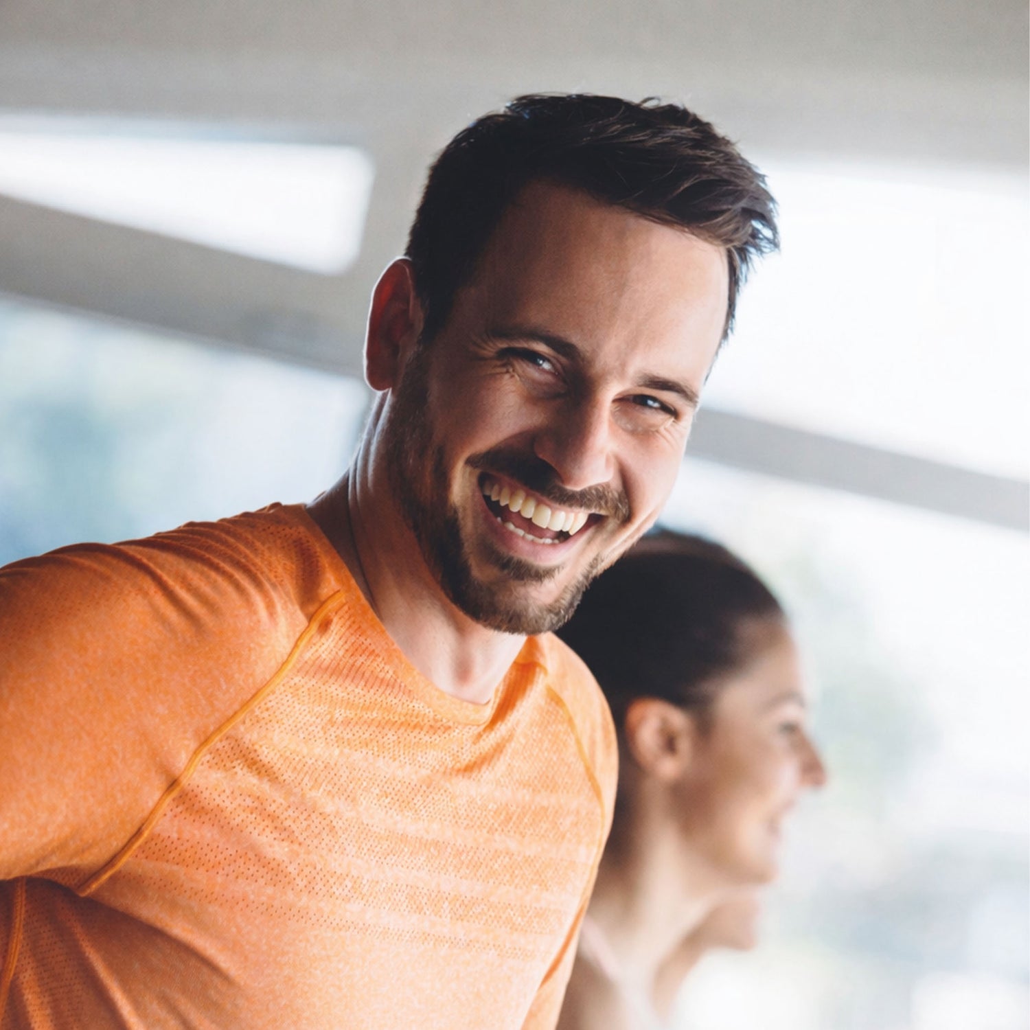 Man happy in gym background